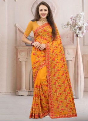 Hypnotizing Mustard Embroidered Georgette Classic Saree